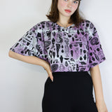Black 'Curio' on Hyacinth Cropped Loose Tee