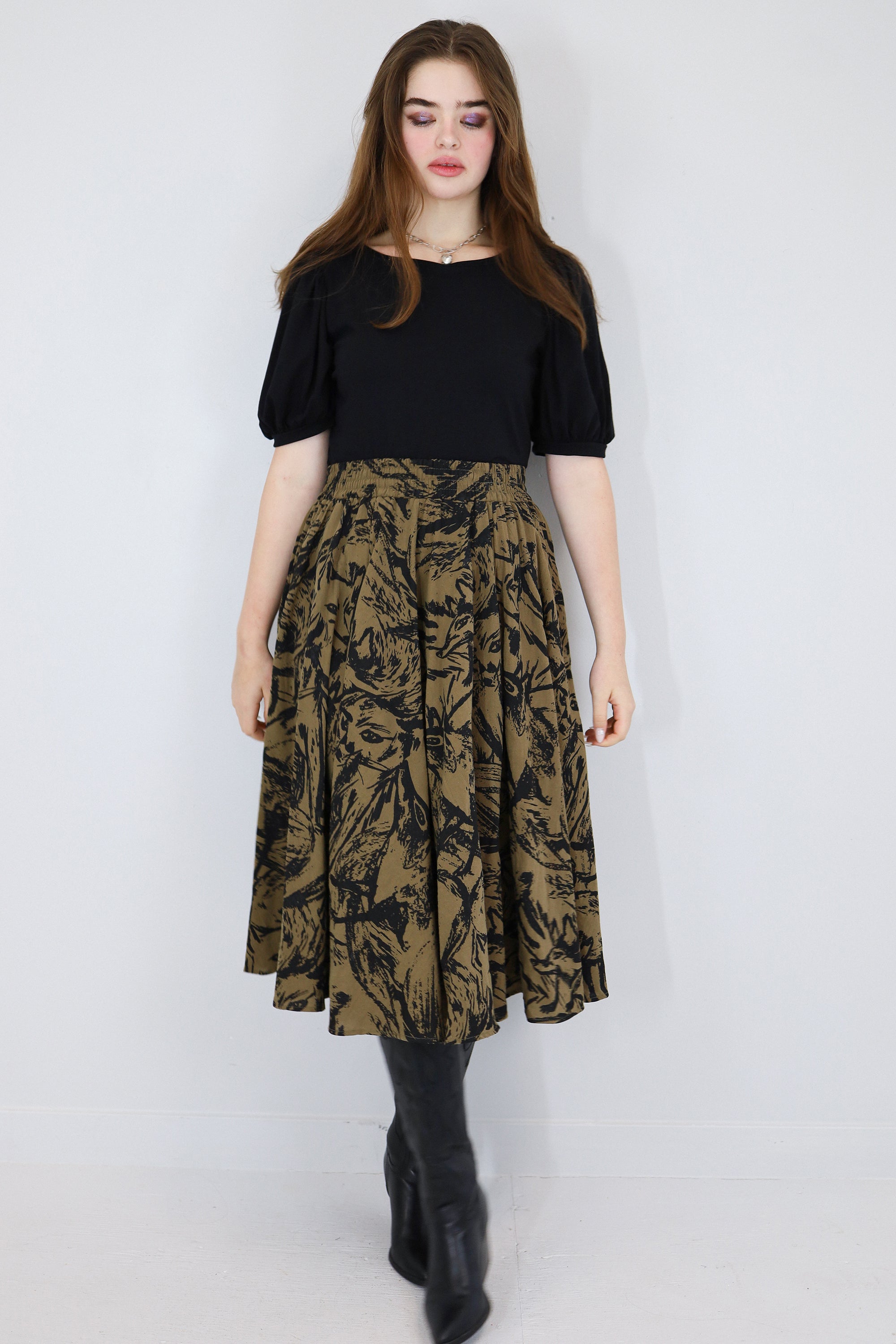 Model wearing a brown twirl circle skirt in a fox print