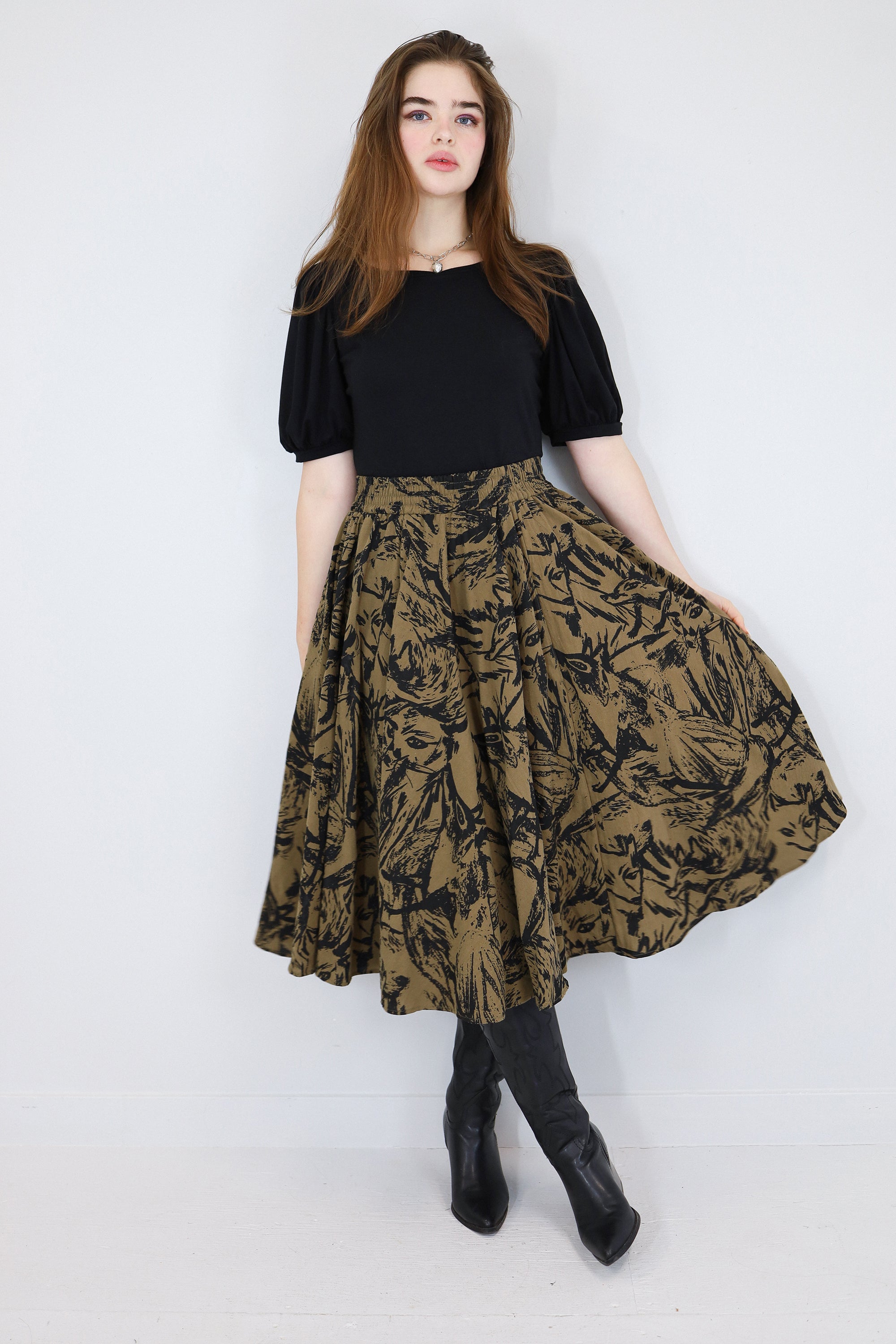 Model wearing a brown twirl circle skirt in a fox print