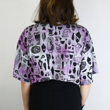 Black 'Curio' on Hyacinth Cropped Loose Tee