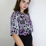 Black 'Curio' on Hyacinth Cropped Loose Tee