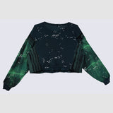 Black and green gradient crop top with star pattern on a white background