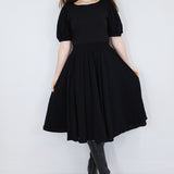 Model wearing a black twirl circle skirt