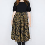 Model wearing a brown twirl circle skirt in a fox print