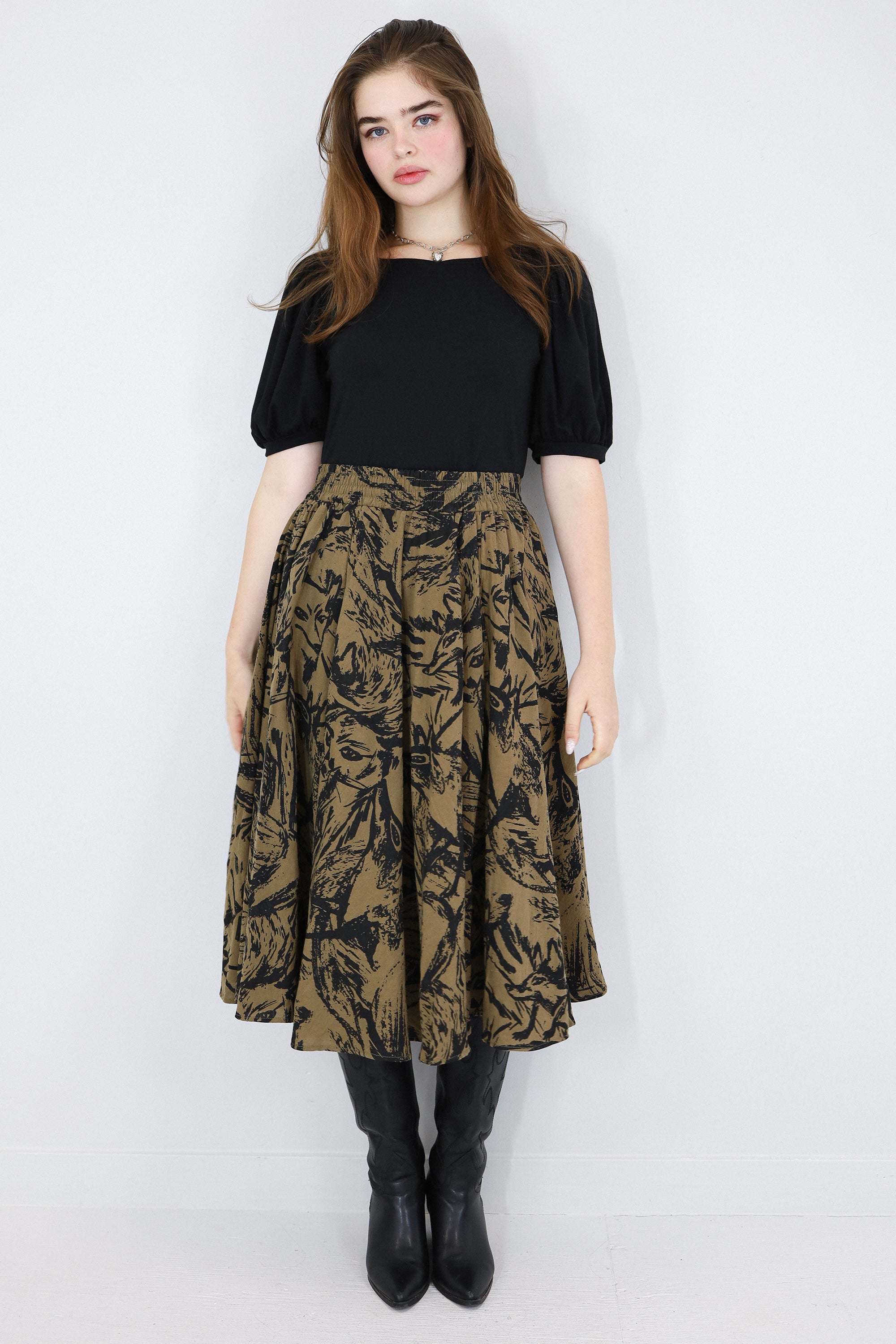 Model wearing a brown twirl circle skirt in a fox print