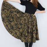 Model wearing a brown twirl circle skirt in a fox print