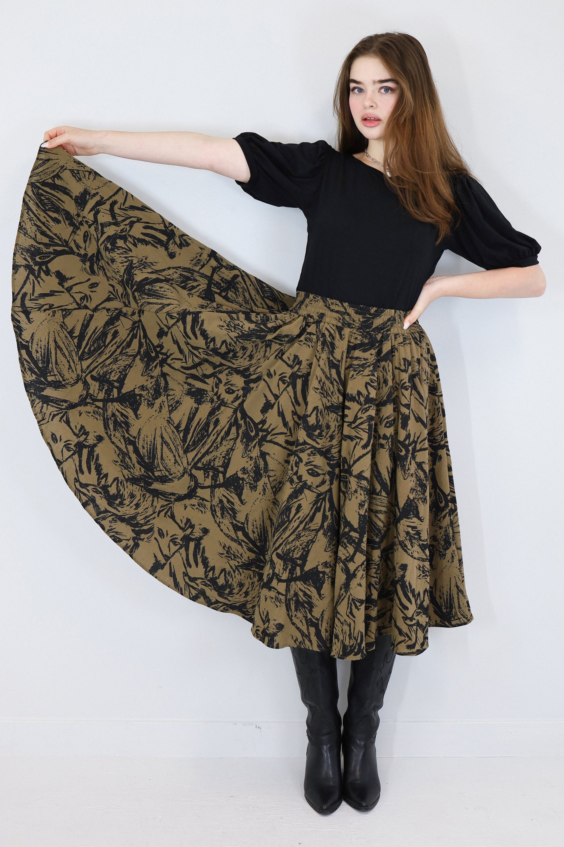 Model wearing a brown twirl circle skirt in a fox print