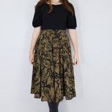 Model wearing a brown twirl circle skirt in a fox print