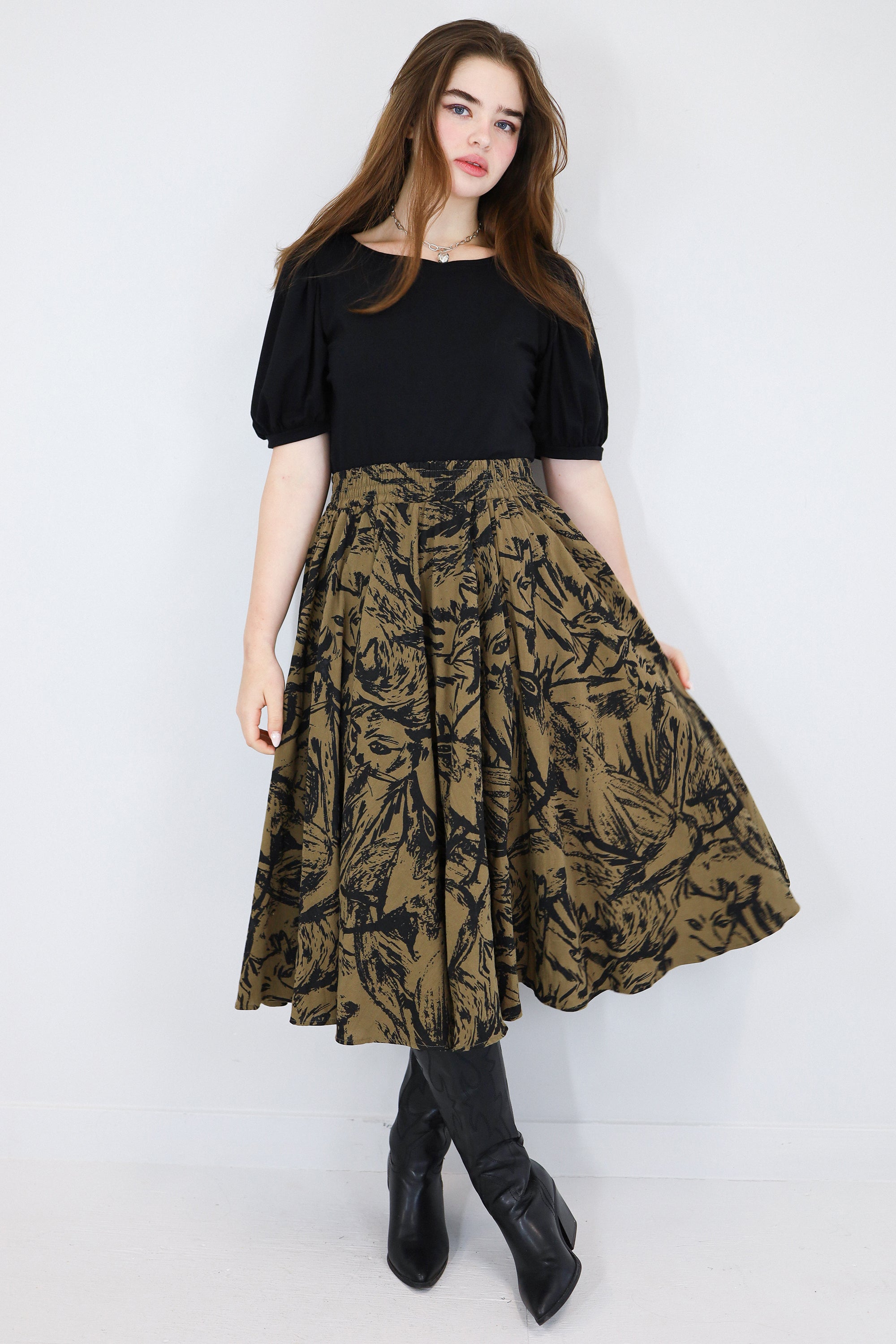 Model wearing a brown twirl circle skirt in a fox print