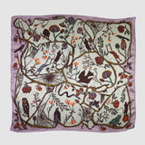 Decorative scarf with nature-themed design on a light purple background
